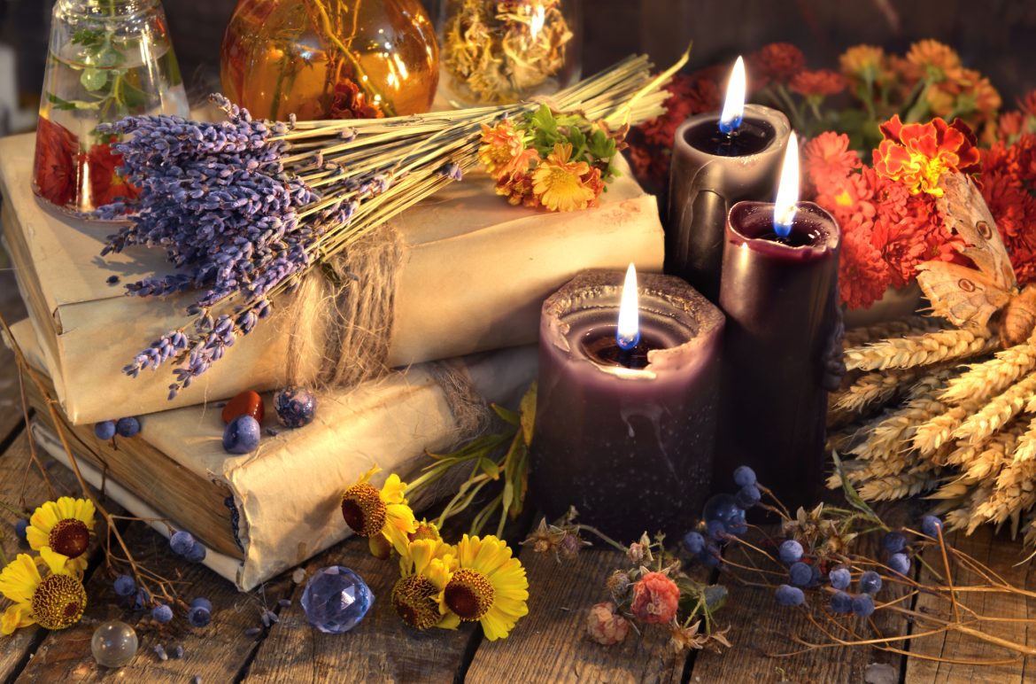 Three black candles, lavender bunch, healing herbs and flowers Powerful Spells