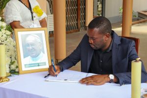 ODM Secretary General Edwin Sifuna signing a condolences book for Pope Francis at Holy Family Basilica, Nairobi. PHOTO/@edwinsifuna/X
